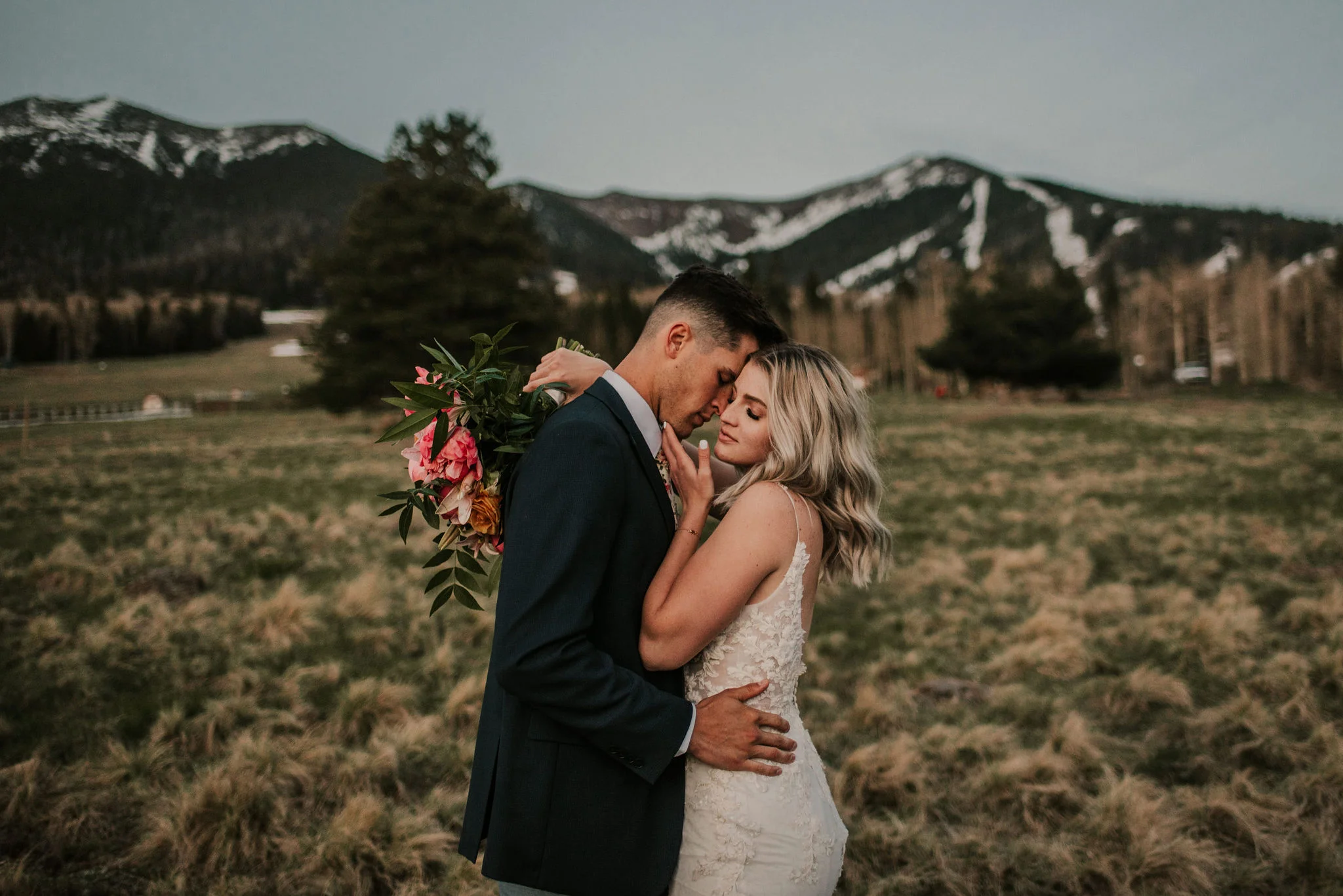 Breathtaking Mountain Elopement Portraits with Bright Flowers Photographed by Big Sur Wedding Photographers Tessa Tadlock