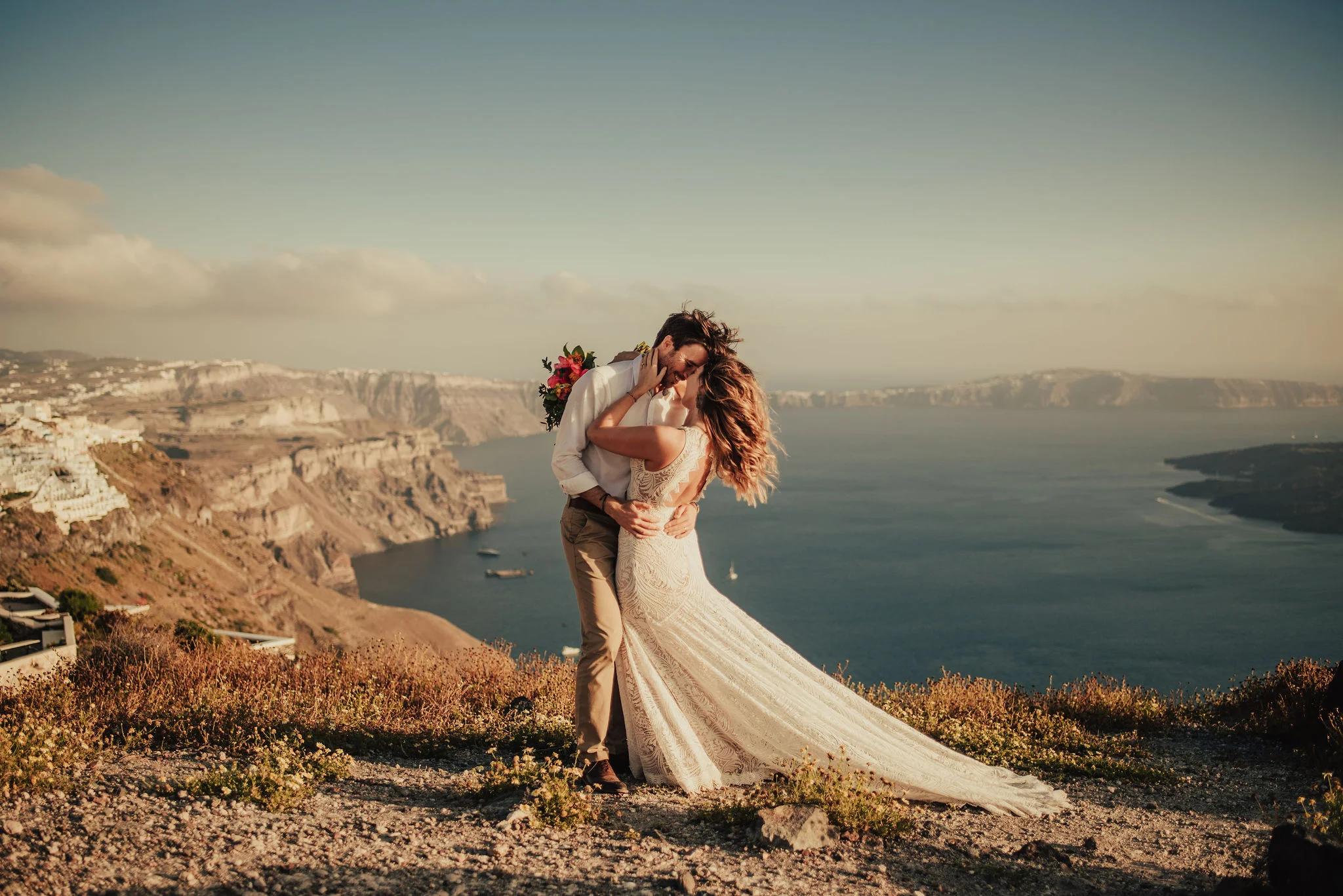Breathtaking Couple Portraits of Boho Bride & Groom on Santorini Coast Photographed by Santa Barbara Wedding Photographers Tessa Tadlock