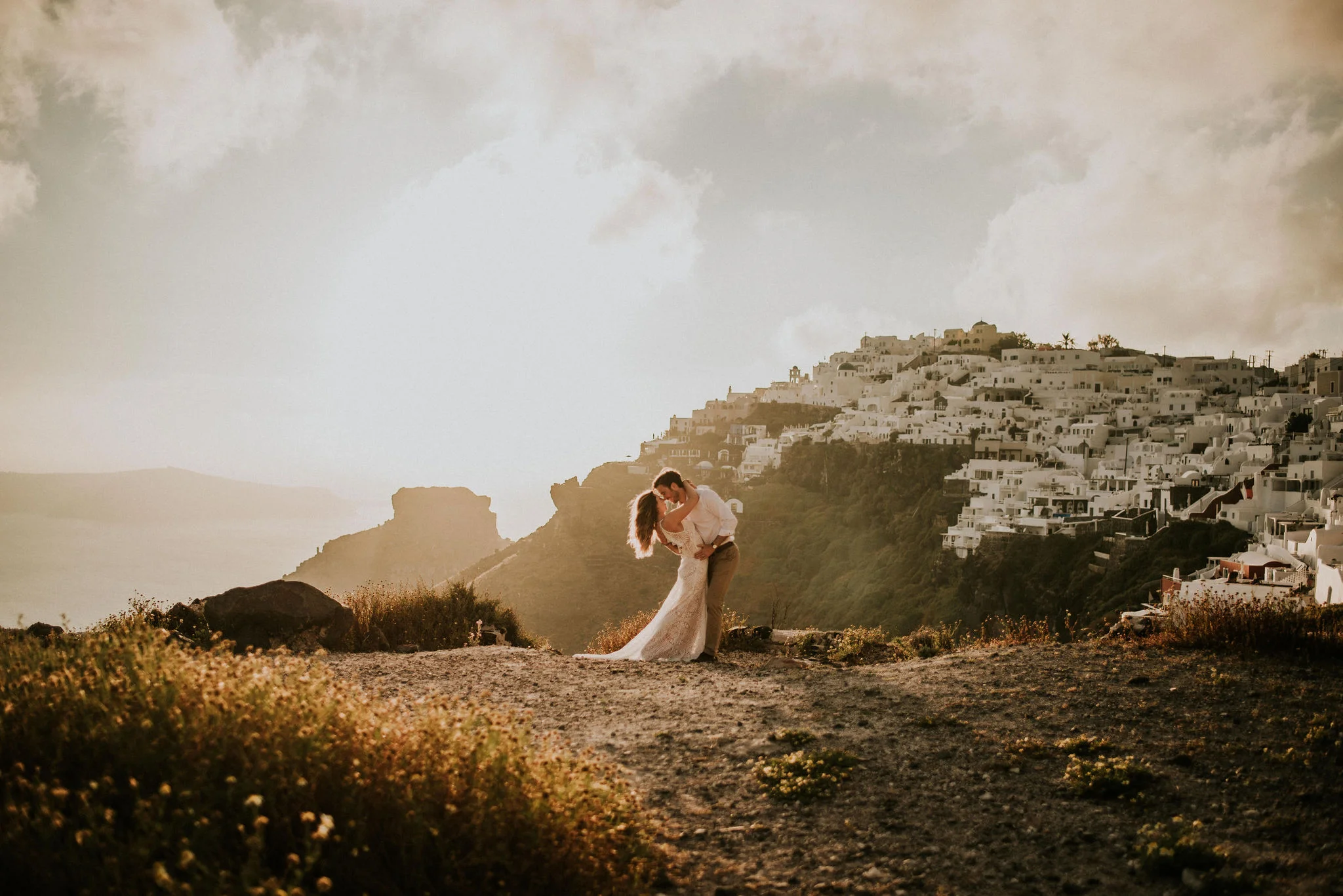 Breathtaking Bride &amp; Groom Portraits on Greek Island Cliffside photographed by Big Sur wedding photographers Tessa Tadlock
