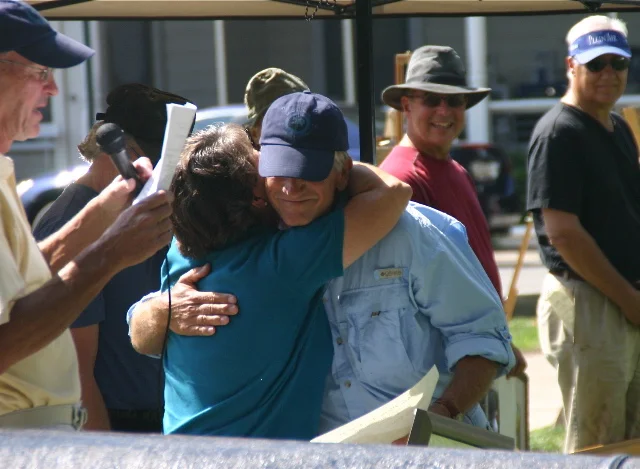 Mary Hugs a Prize Winner