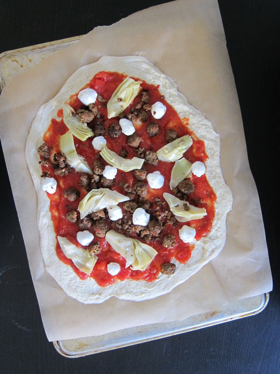 unbaked Merguez pizza