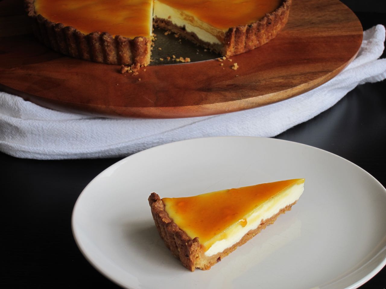 Sliced pistachio labneh kumquat tart