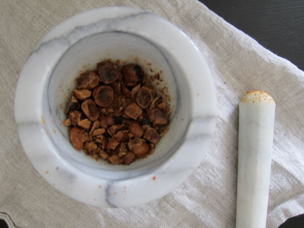 Roast Hazelnuts in mortar and pestle.jpg