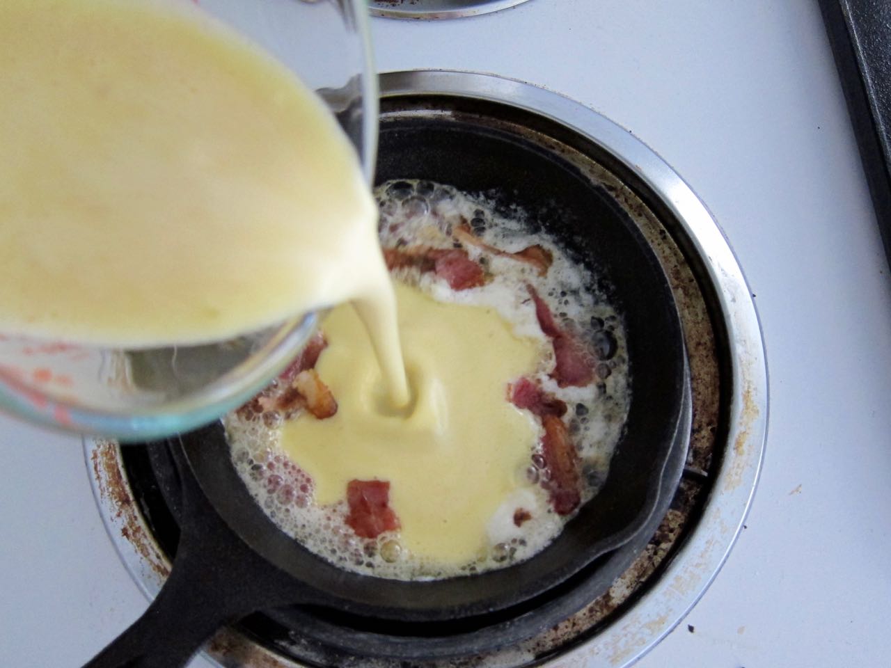 Pouring Dutch Pancake Batter into hot pan.jpg