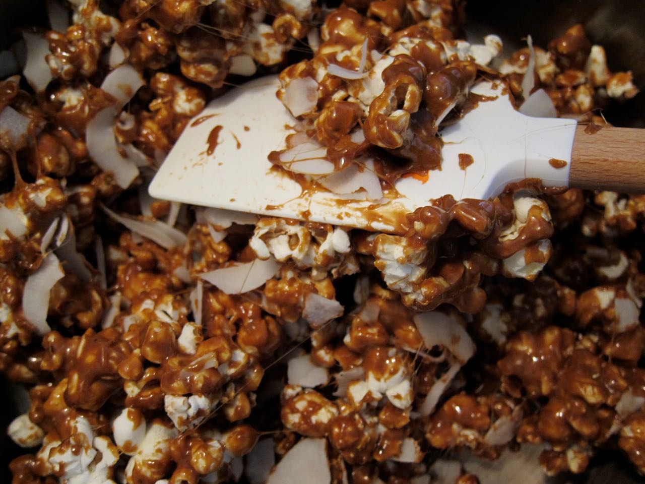 mixing coconut curry caramel corn