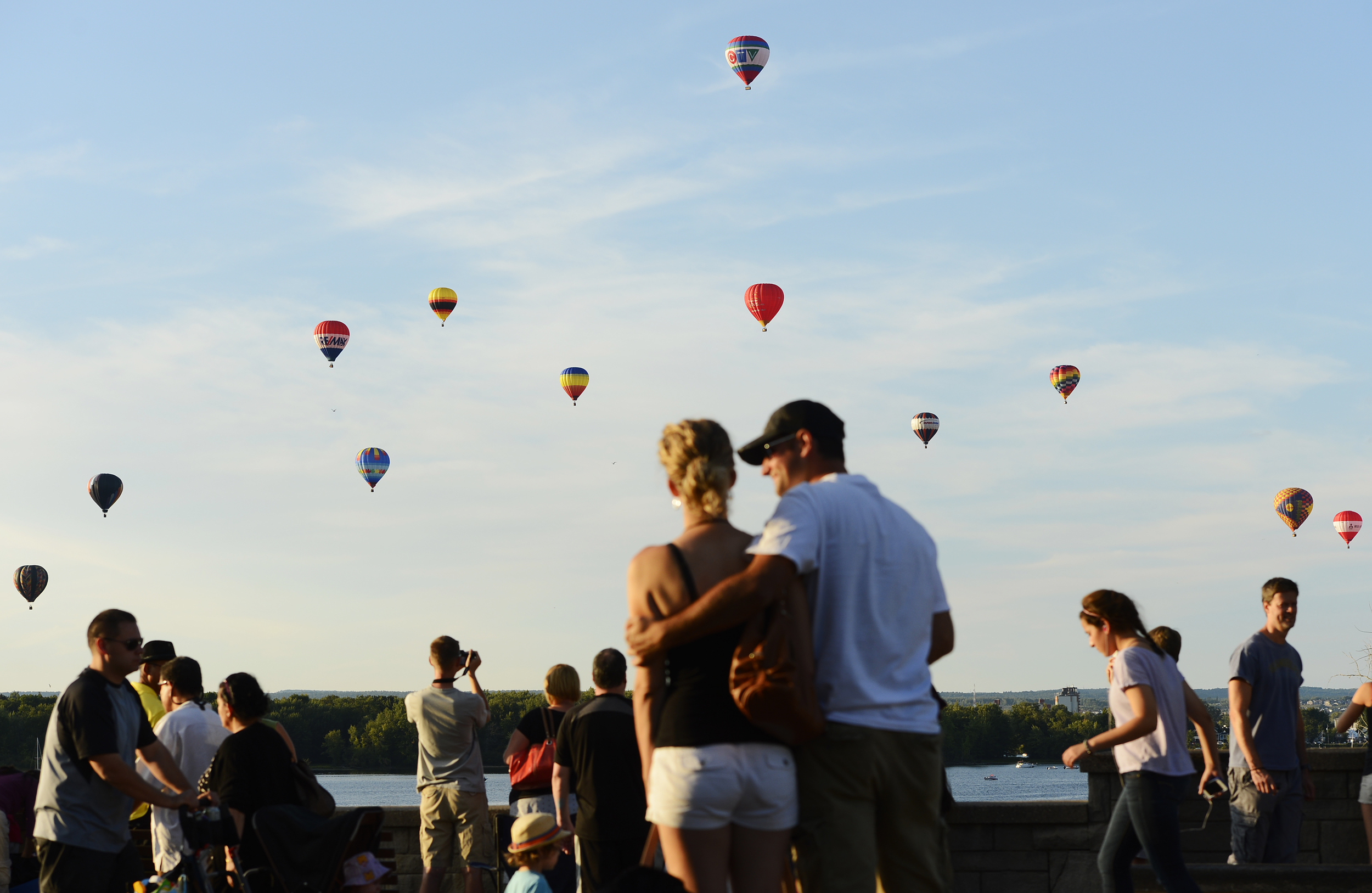  Hot air balloons rise over Ottawa river from Gatineau Hot Air Balloon Festival. 