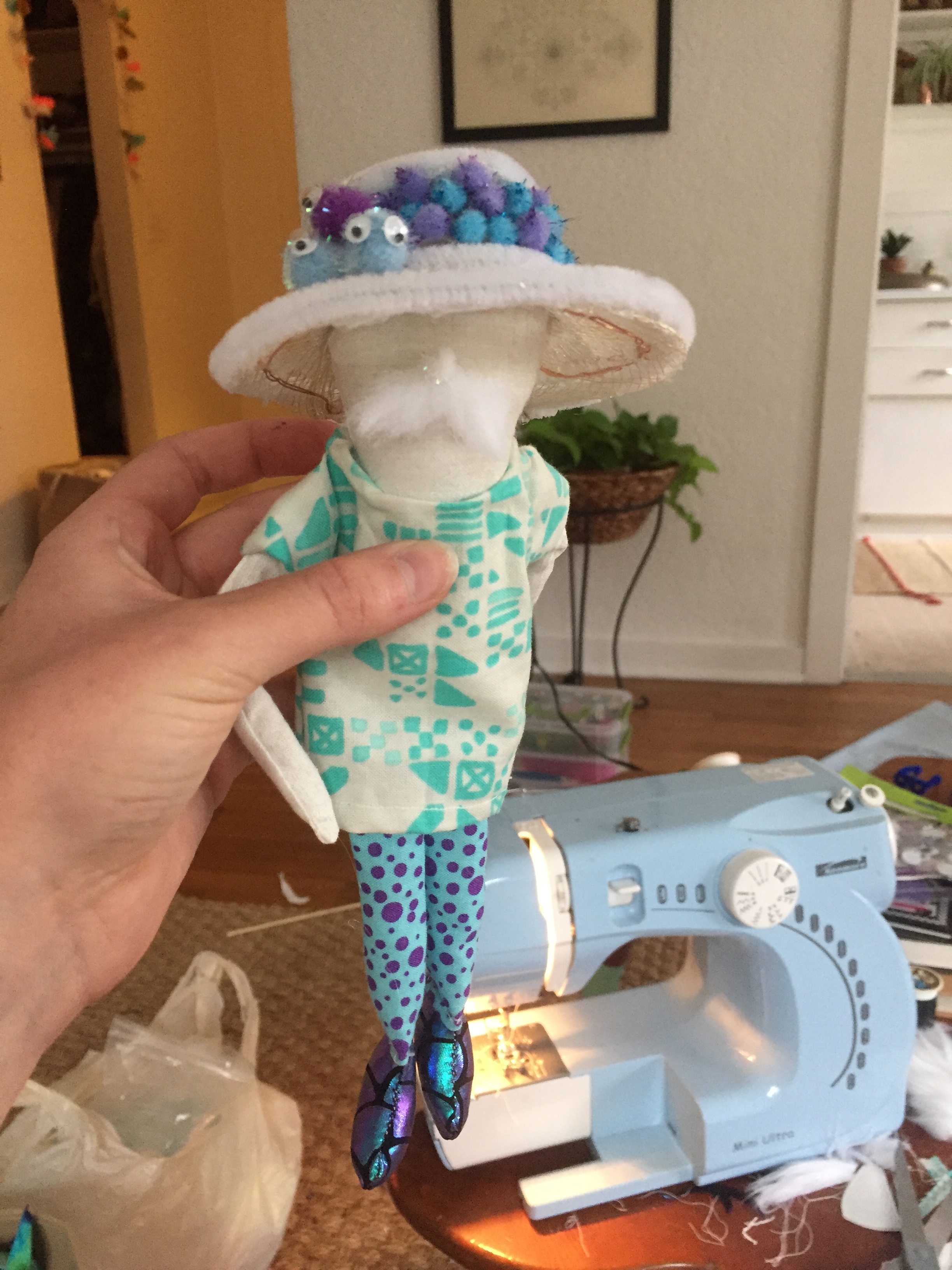 Addition of the facial features and outfit.