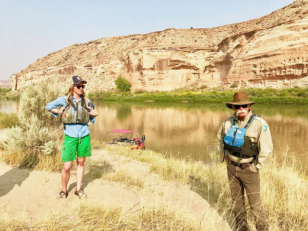 Kate Graham, assistant director of the Colorado Canyons Association, which stewards the three National Conservation Areas on the Western Slope, and Troy Schnurr, a Colorado River ranger, discuss the conservation and restoration efforts at Cottonwood Camp 5 along the Ruby Horsethief stretch of the Colorado River.