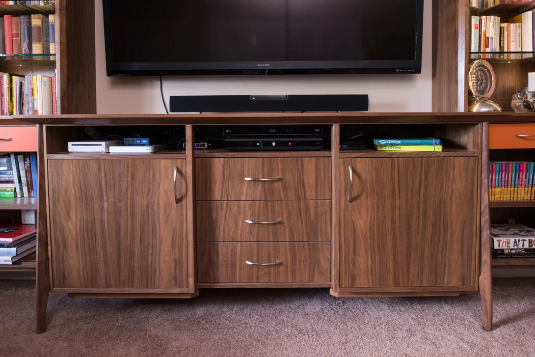 Design + Build of custom Walnut Mid-Century Inspired entertainment center.