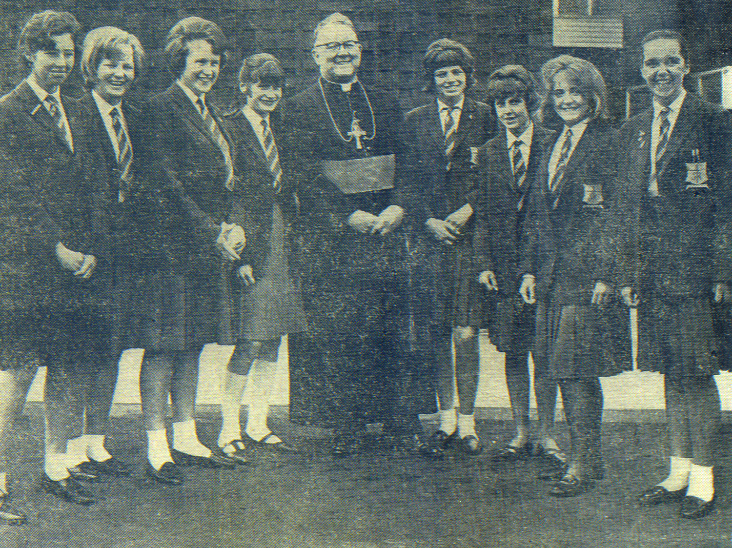 Photo: Bishop Dwyer talks with St. Mary's pupils after performing the official opening, 3 July 1965 LEFT TO RIGHT: Josephine Joyce, Ruth Copsey, Brenda Hope, Marilyn Dix, Anne Mahon, Stella Kent, Kathleen Lawson and Rosaleen Doran Photograph kindly donated by Rosaleen Doran (Fisher) Head Girl