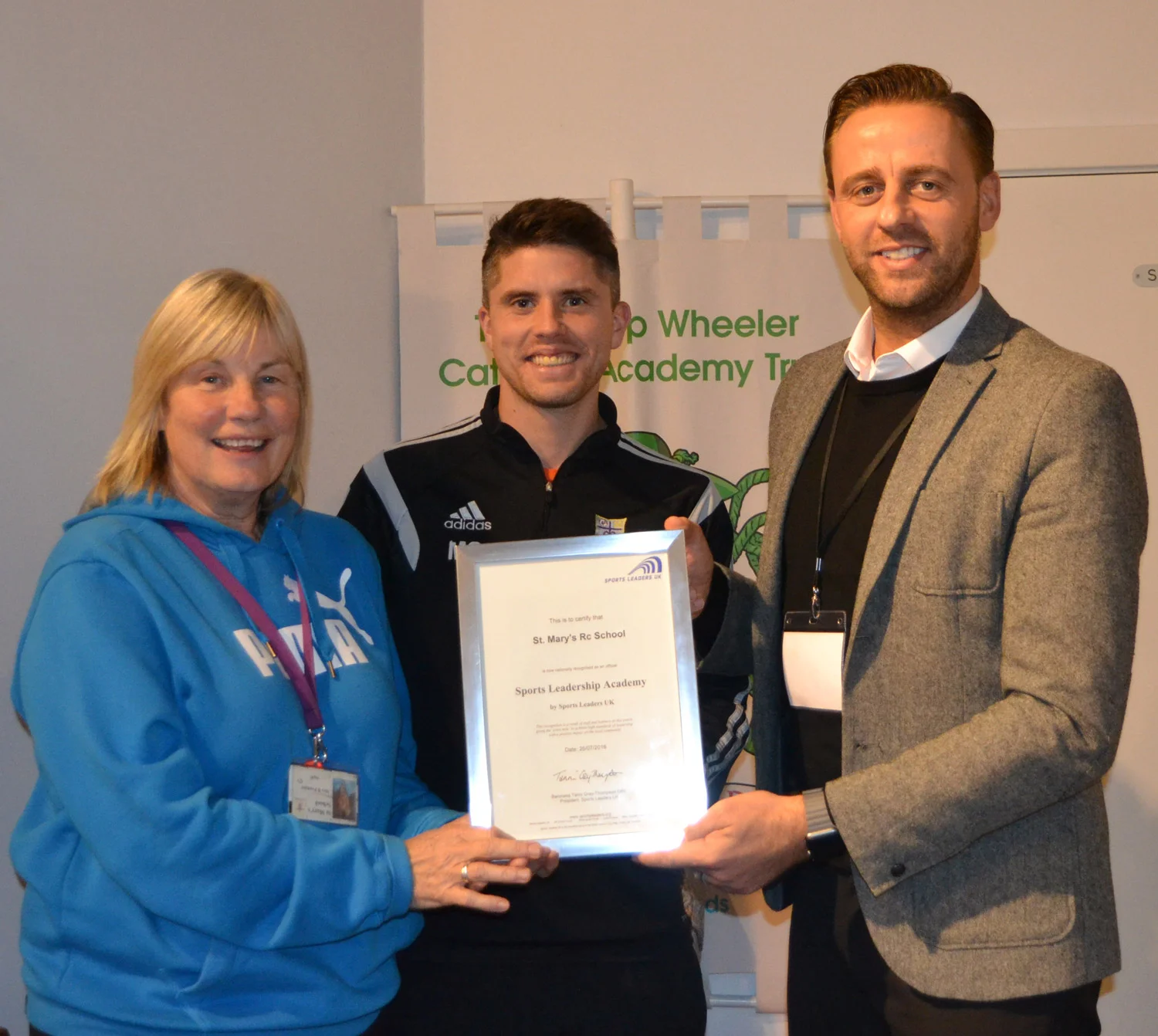 Photo: Mr David Savage from Sports Leaders UK presented the award to St. Mary’s PE Teachers Mrs Pounder and Mr Pringle on behalf of the Faculty of PE and Sport.