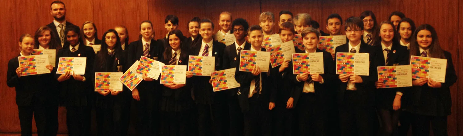Photo: Student Progress Leader, Mr T Hamill joins students with their awards after the assembly