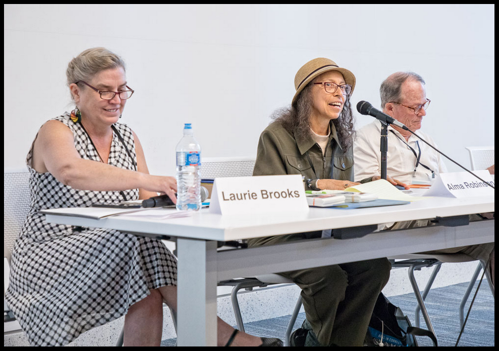 Laurie Brooks, Alma Robinson, and Jack Bowers presenting at a conference on arts in the prisons.