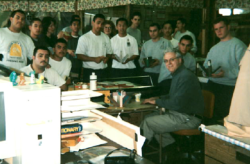 Steve, book artist Beth Thielen, and wards in bookbinding workshop.