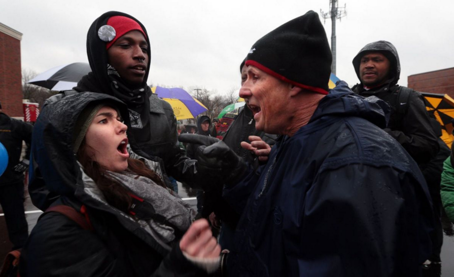"I'm going to knock your teeth out you little bitch", Photograph from St. Louis Post Dispatch of me being yelled at a Pro Police Rally by a former St. Louis County Police Officer , 2015