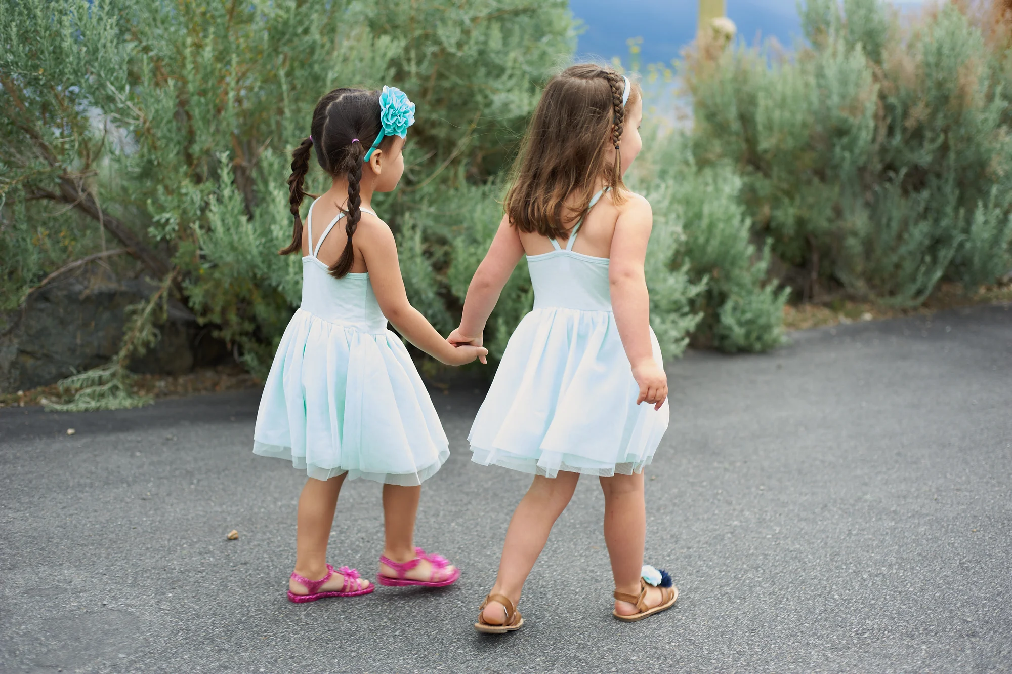 two flower girls walking