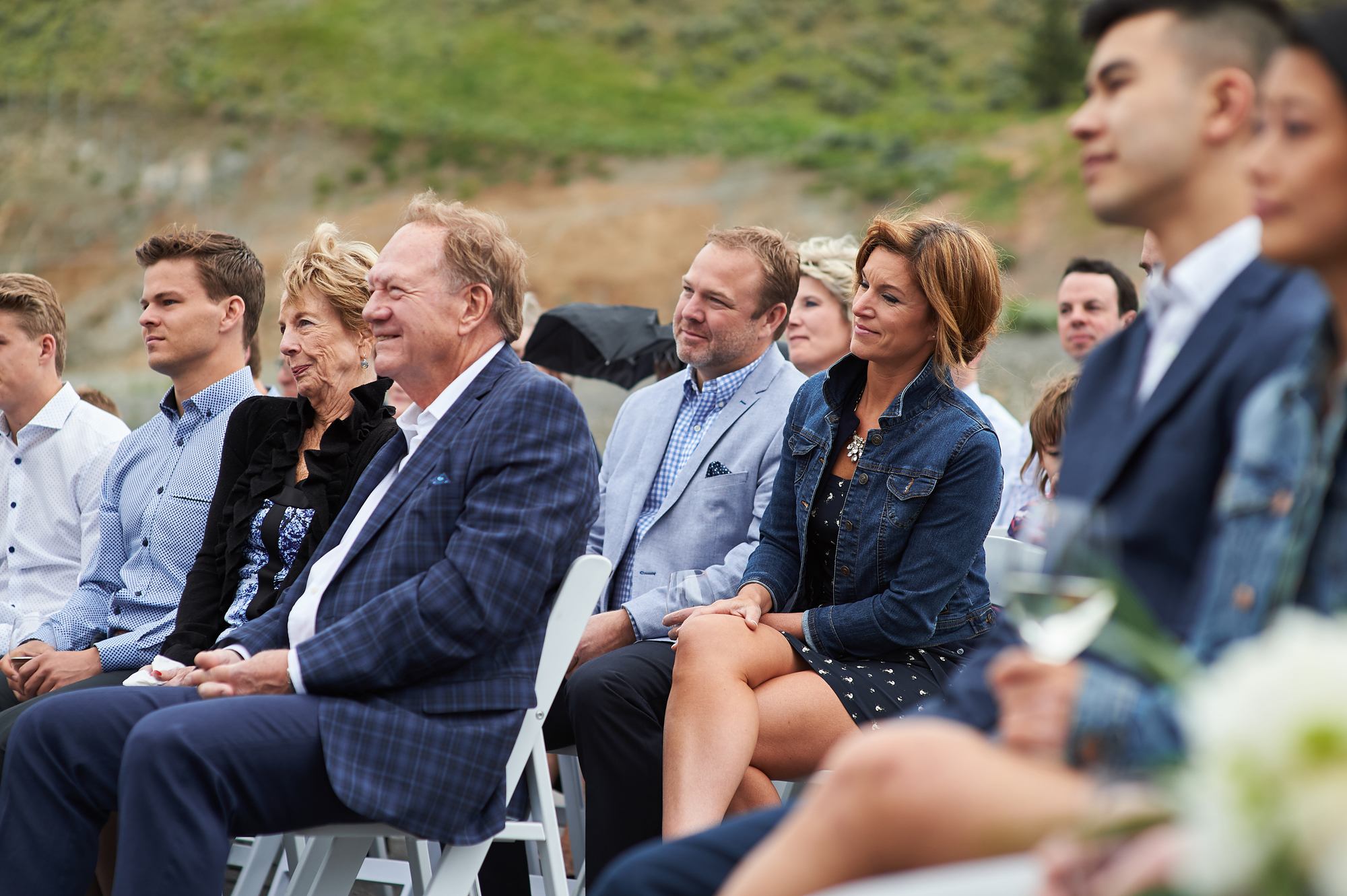 the wedding guests look on