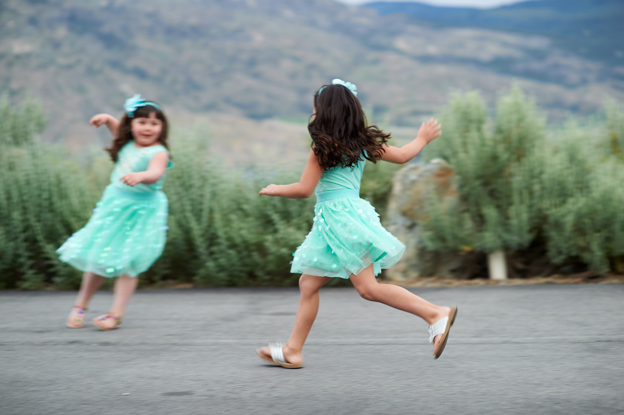 two flower girls playing
