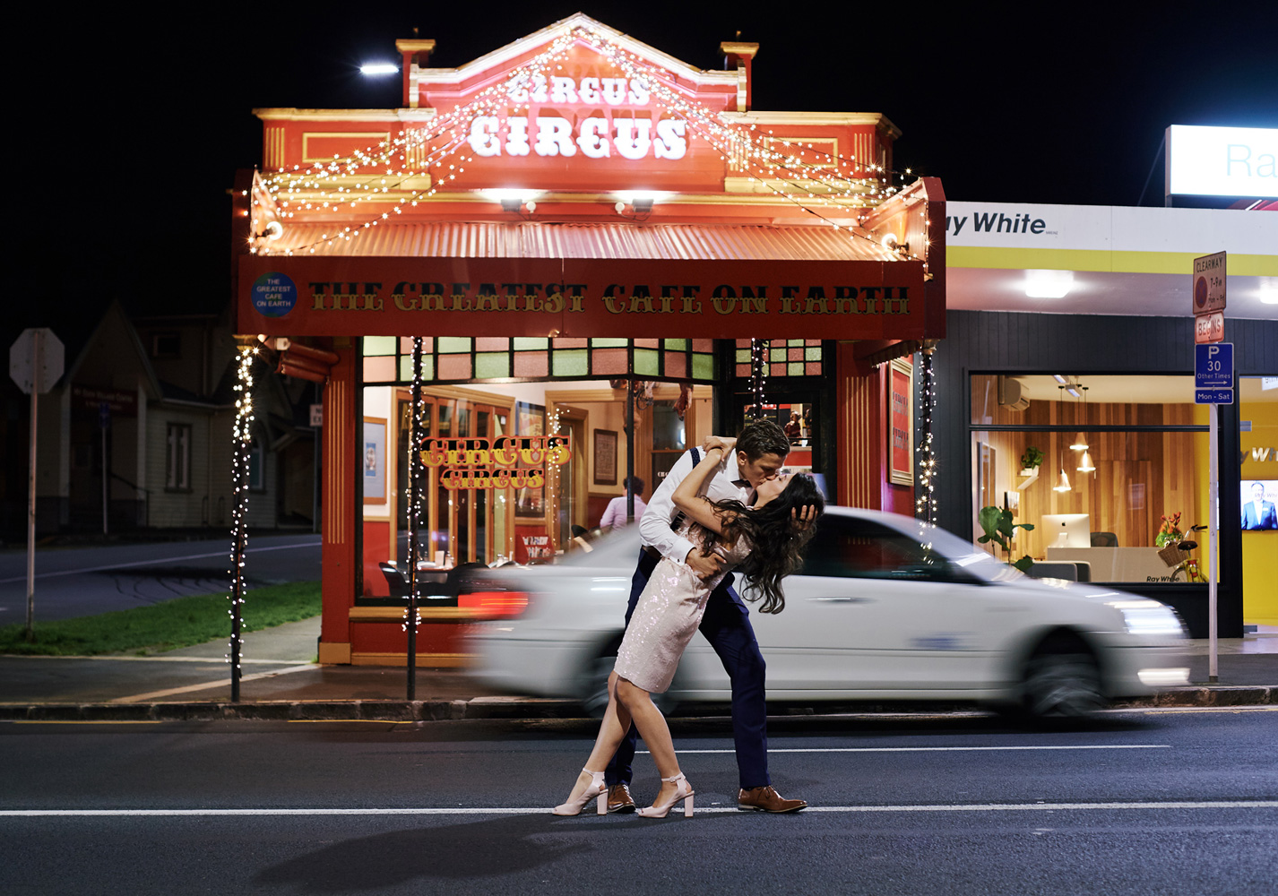 romantic kiss with bride and groom