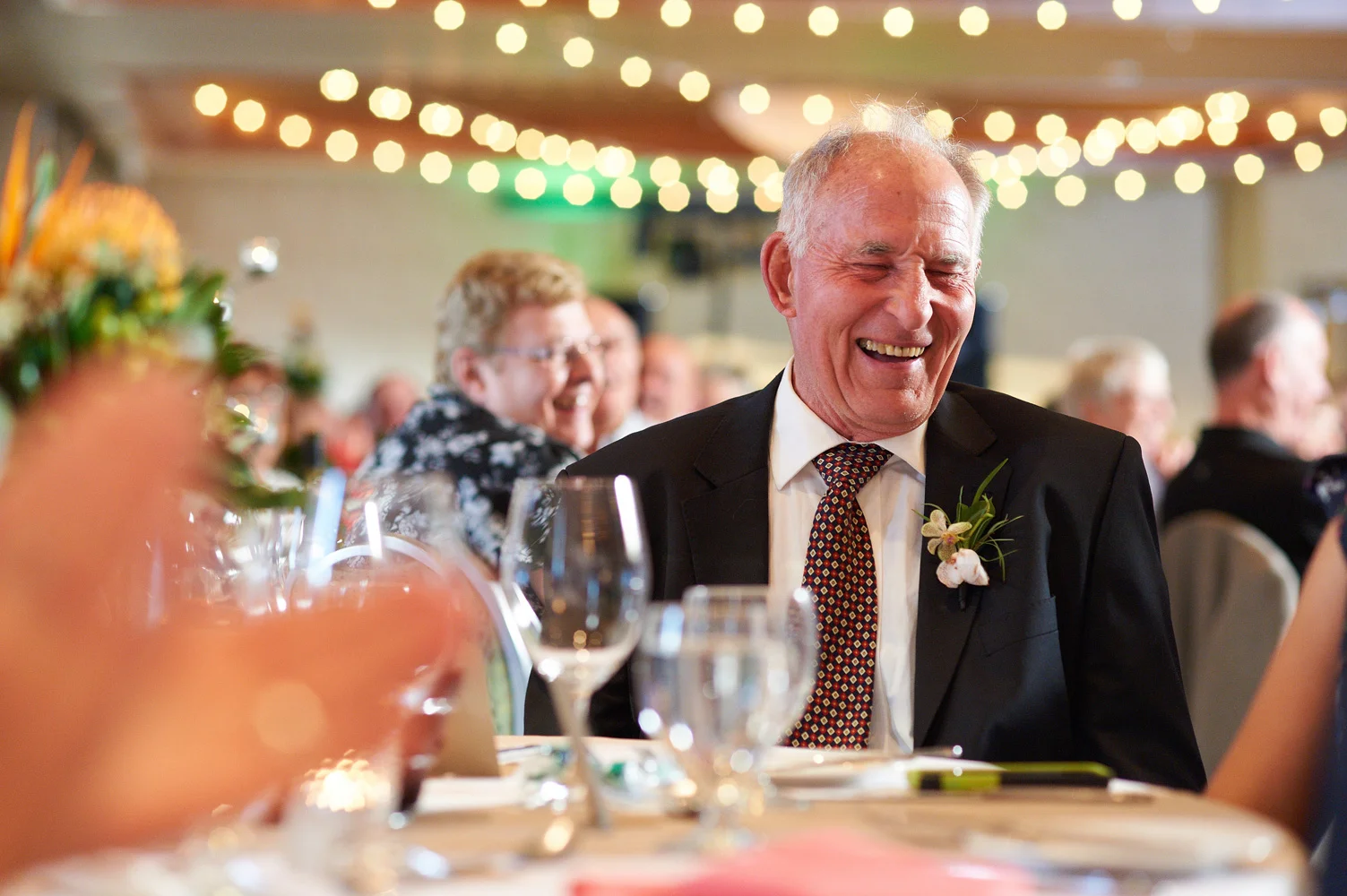 uncle laughing at wedding reception