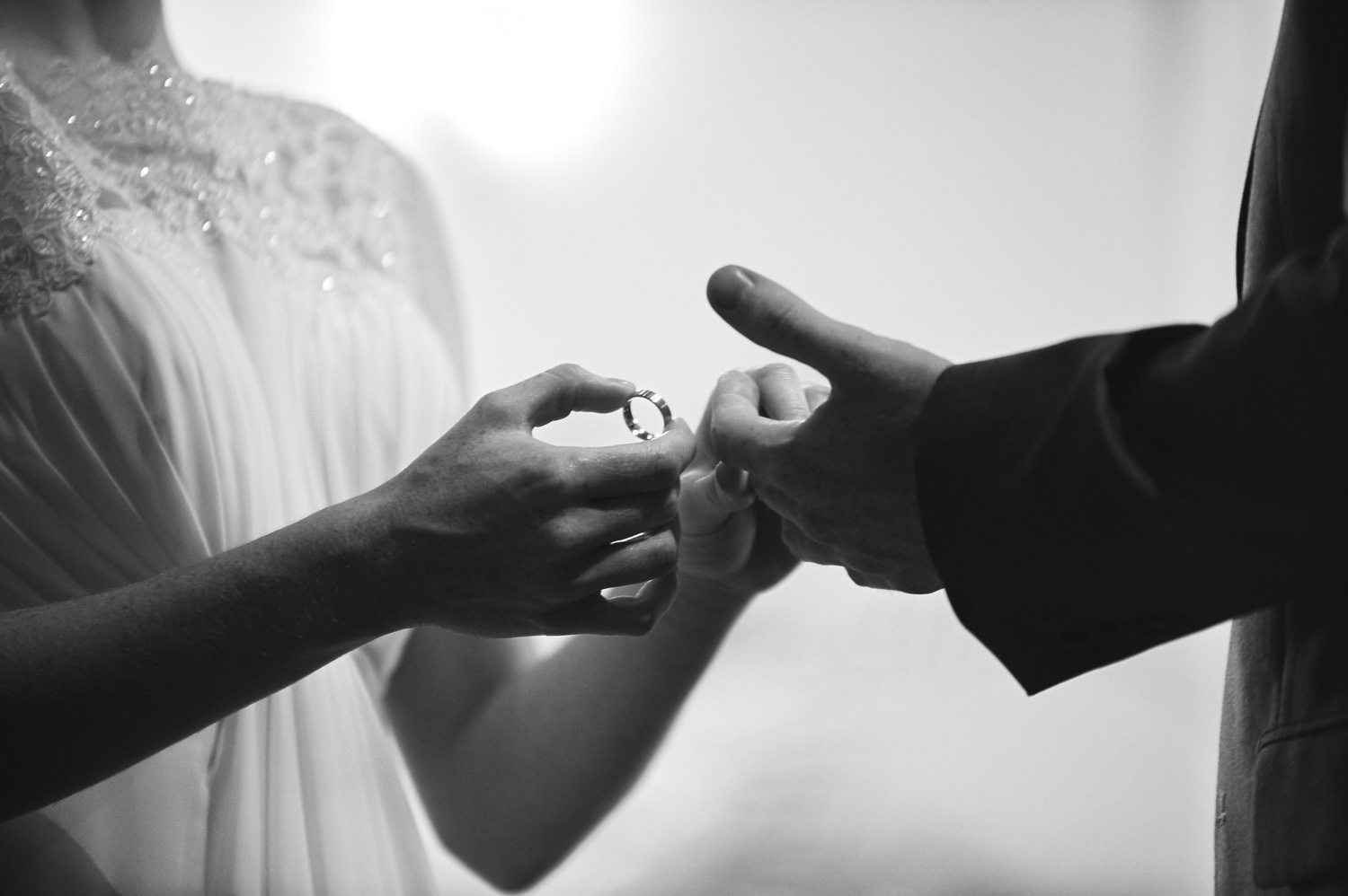 bride-and-groom-exchanging-wedding-rings.jpg