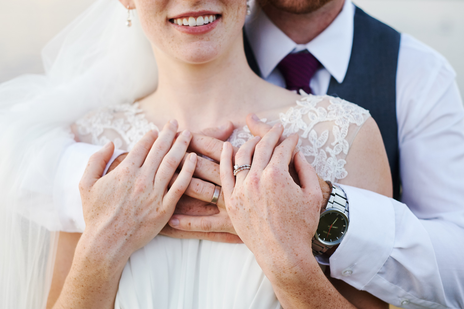 bride-and-groom-formal-portrait-with-wedding-rings.jpg