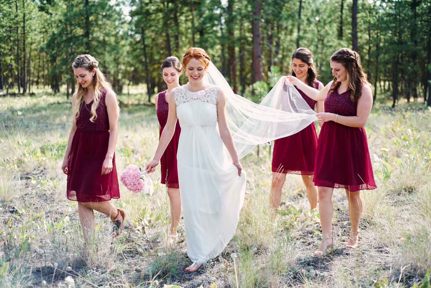 bride-and-her-bridesmaids-walkign-through-the-forest.jpg