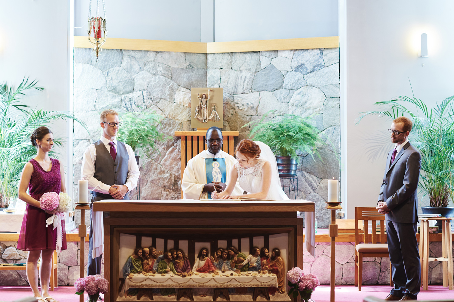 bride-signing-the-register-in-a-roman-catholic-church.jpg