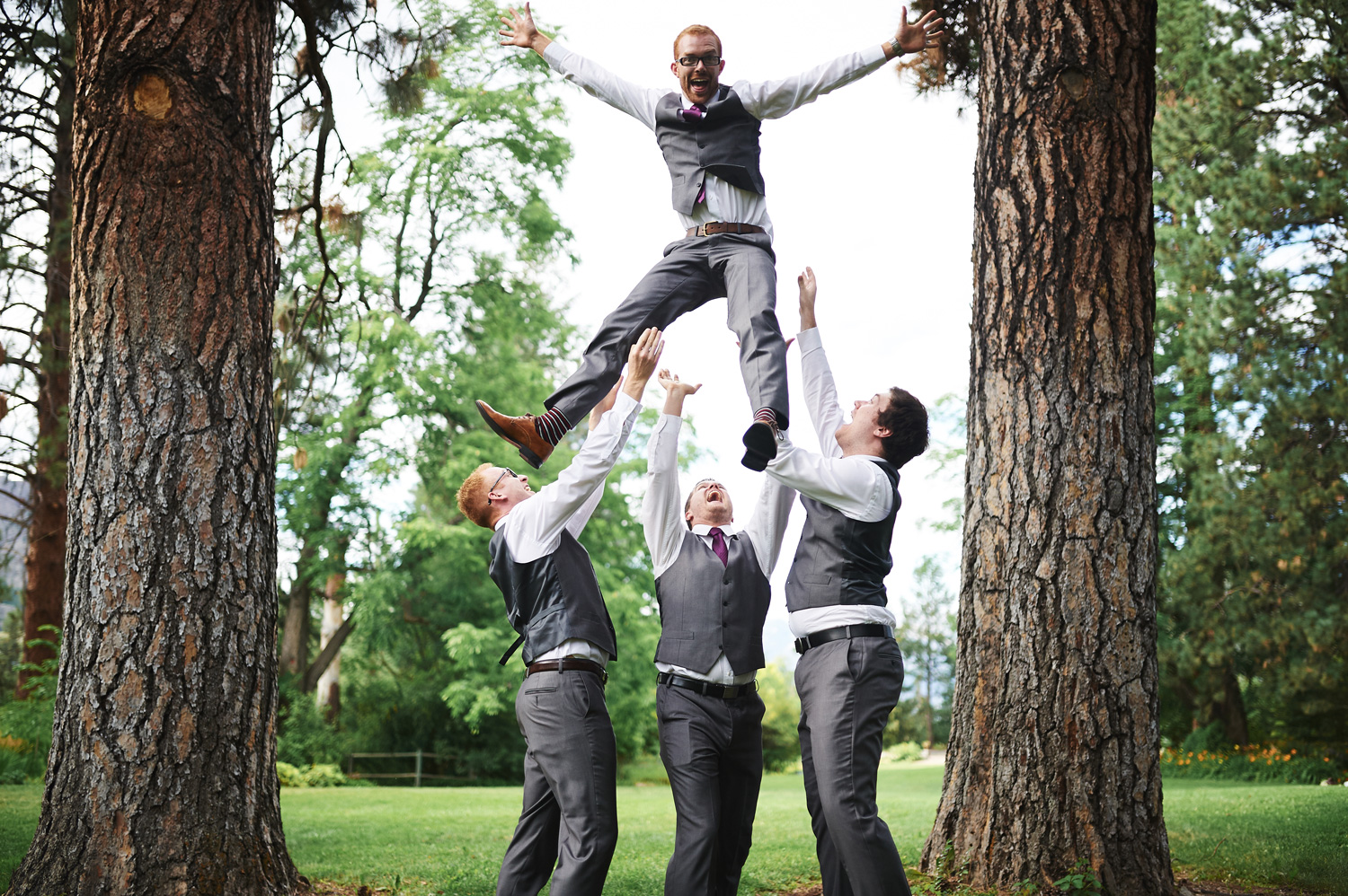 fun-groomsmen-photo-tossing-the-groom-into-the-air.jpg