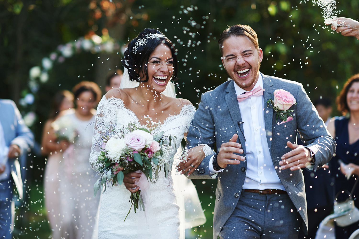 bride-and-groom-walking-back-down-the-aisle-with-rice.jpg