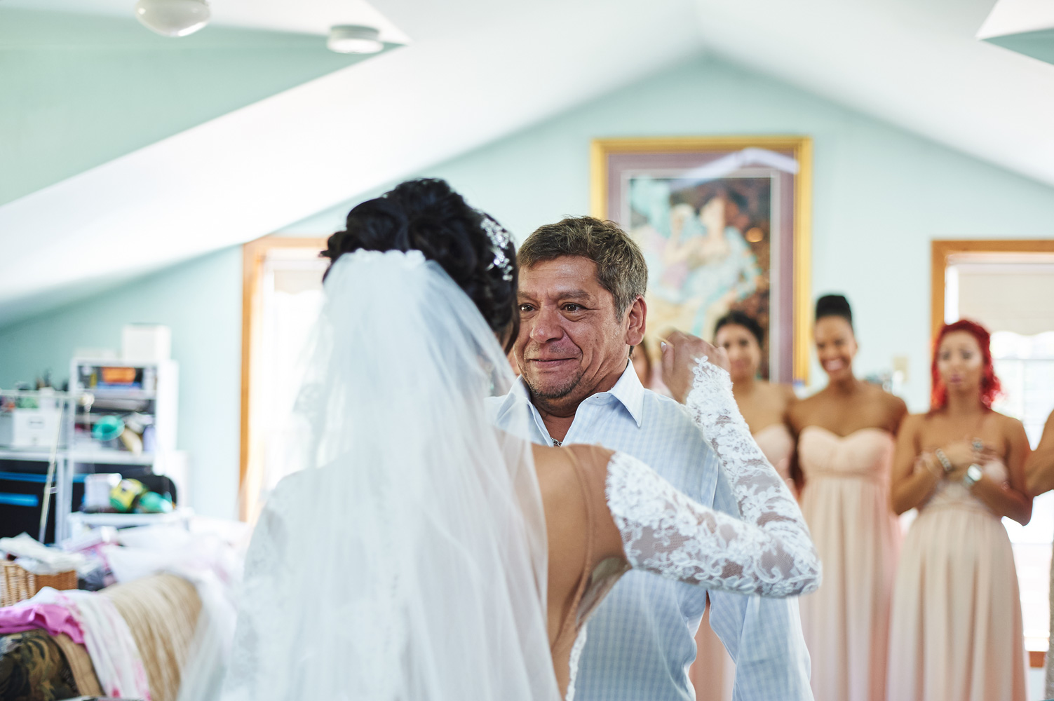 father-of-the-bride-crying-over-seeing-his-daughter-in-her-wedding-dress.jpg