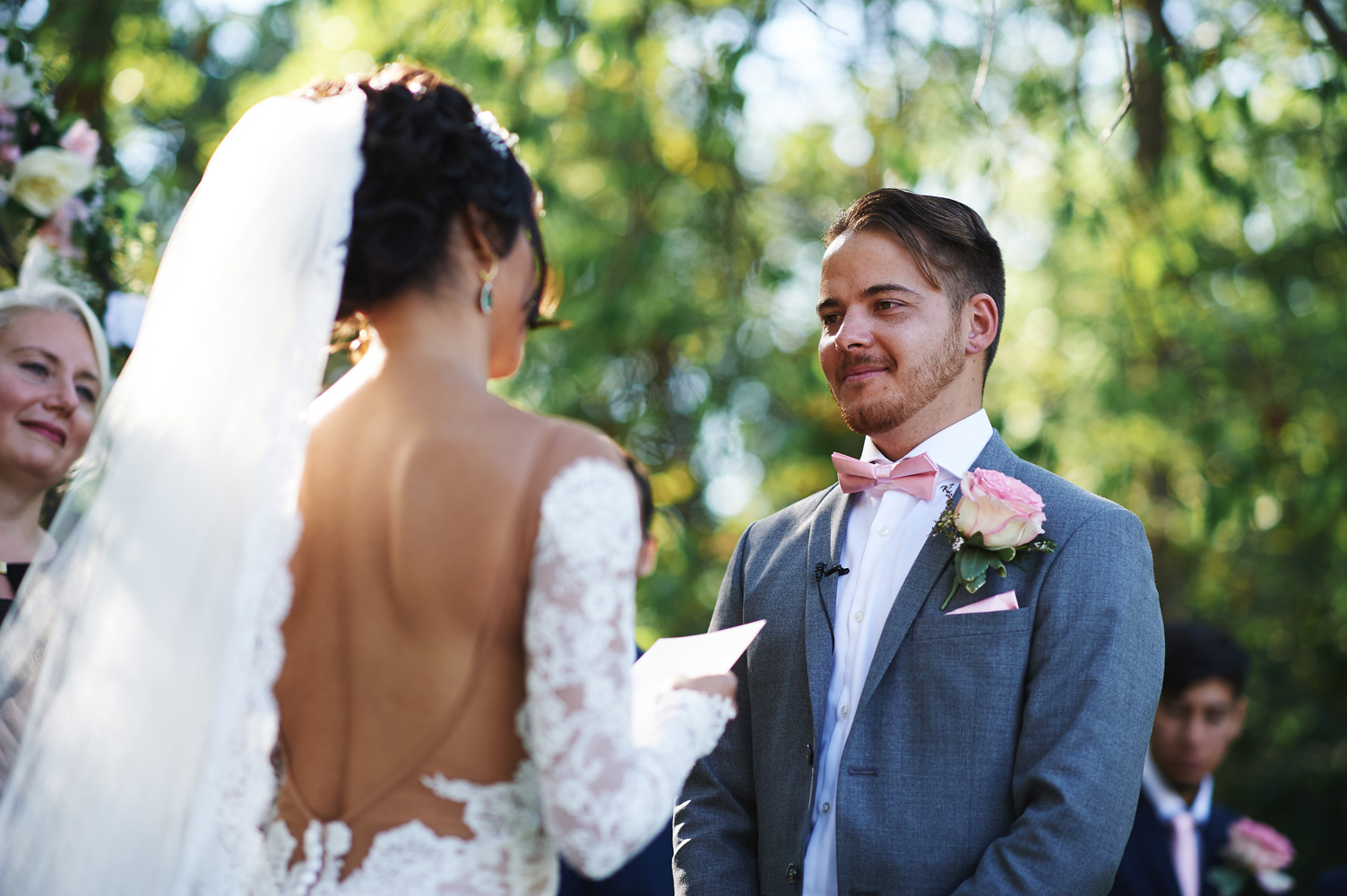 groom-listening-to-the-bride-read-her-vows.jpg