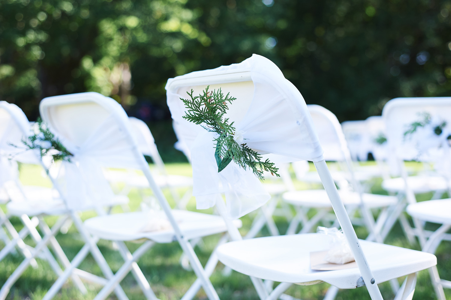 wedding-detail-of-the-ceremony-chairs-outside.jpg