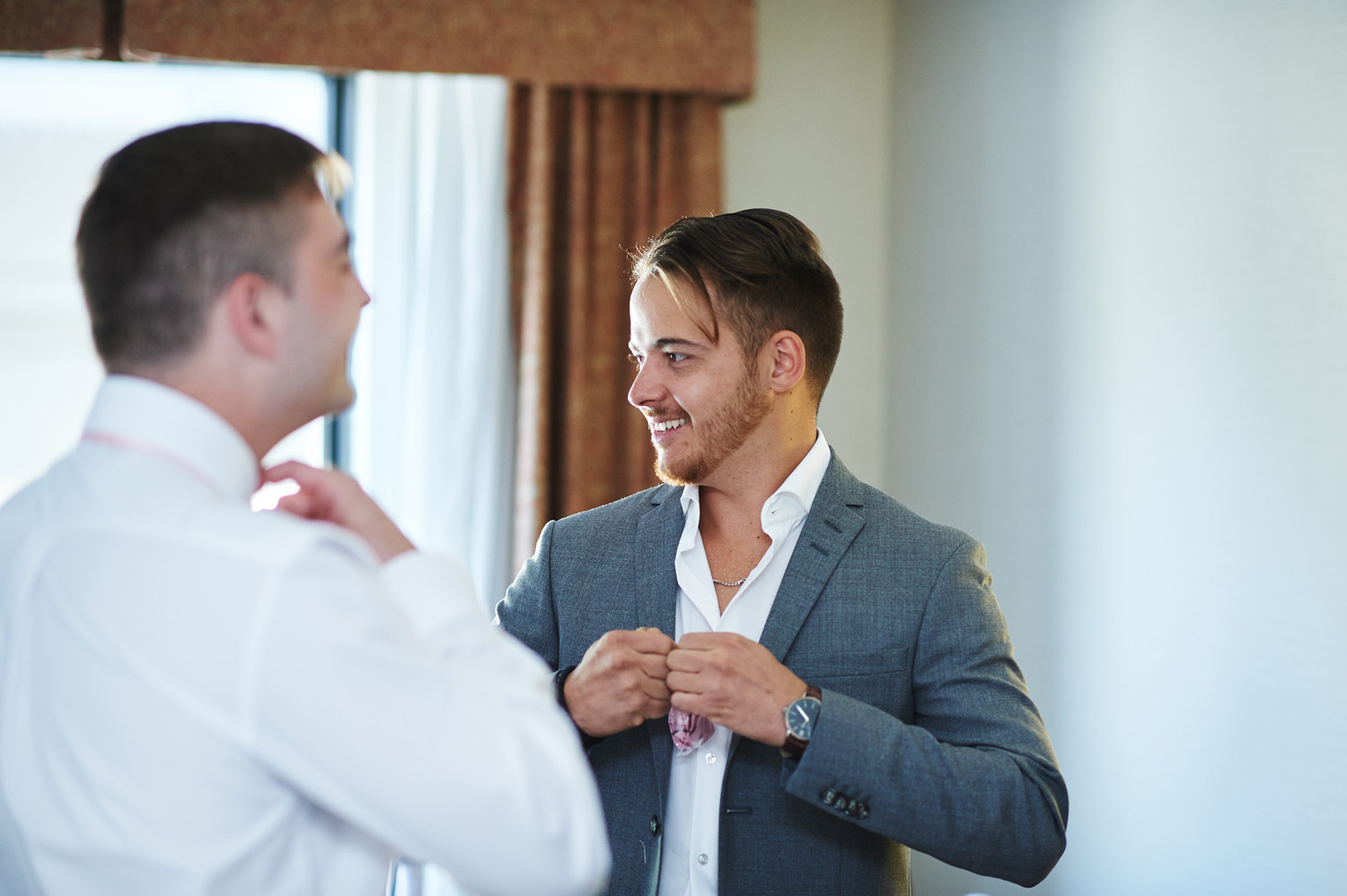 groom-getting-ready-with-his-groomsmen.jpg