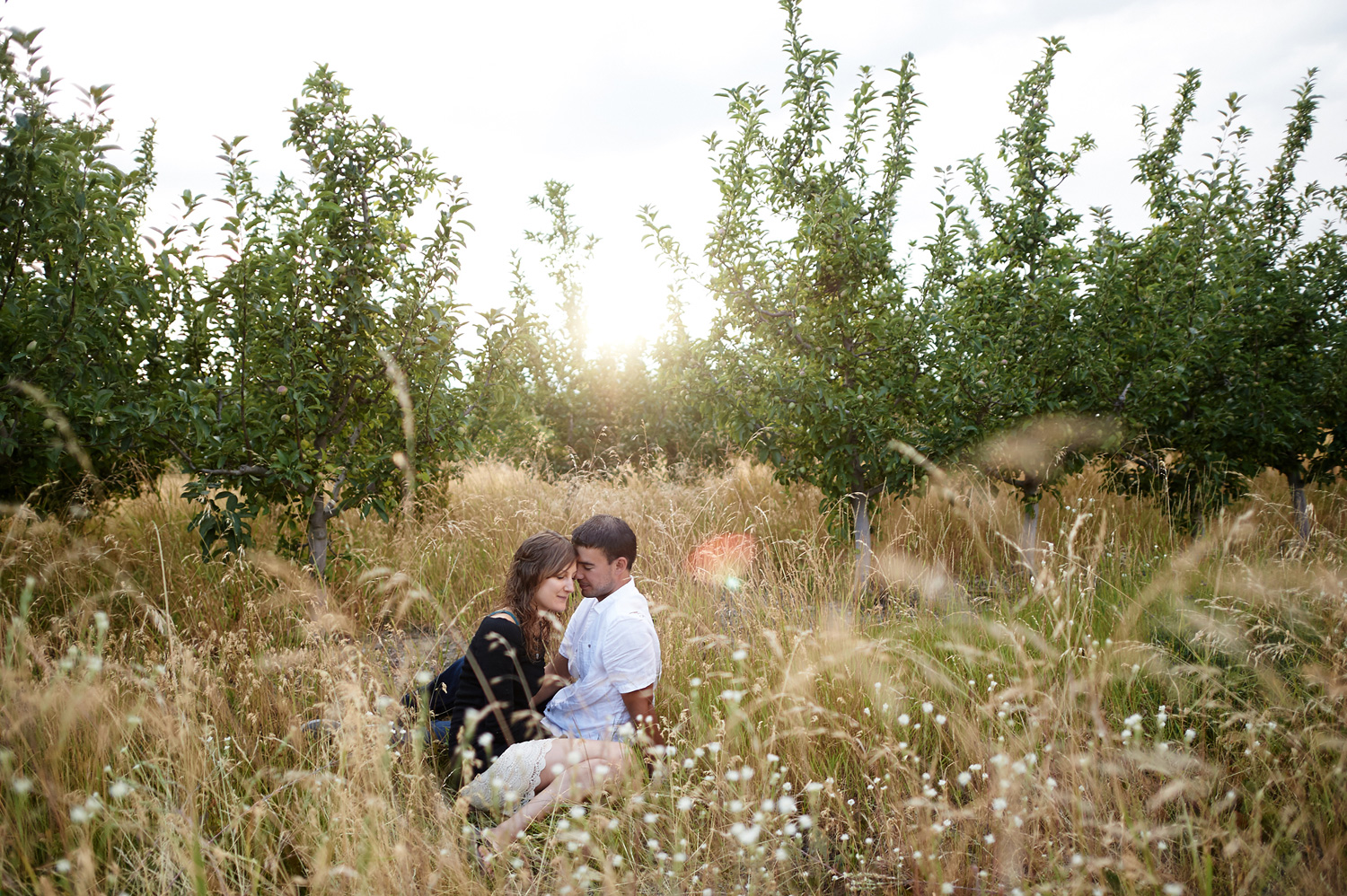 engaged-couple-snuggling-at-golden-hour-in-kamloops.jpg