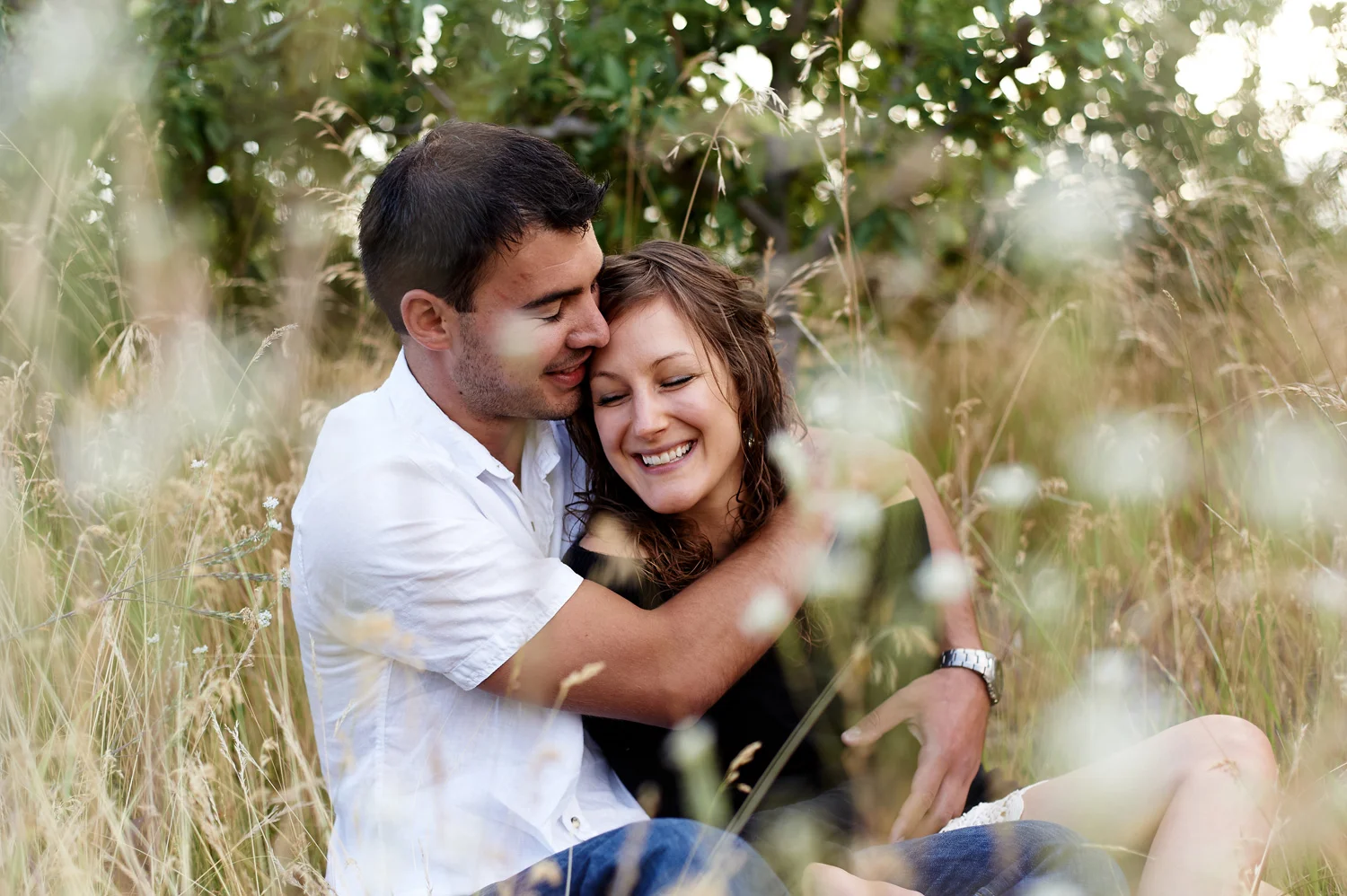 engaged-couple-snuggling-okanagan-.jpg