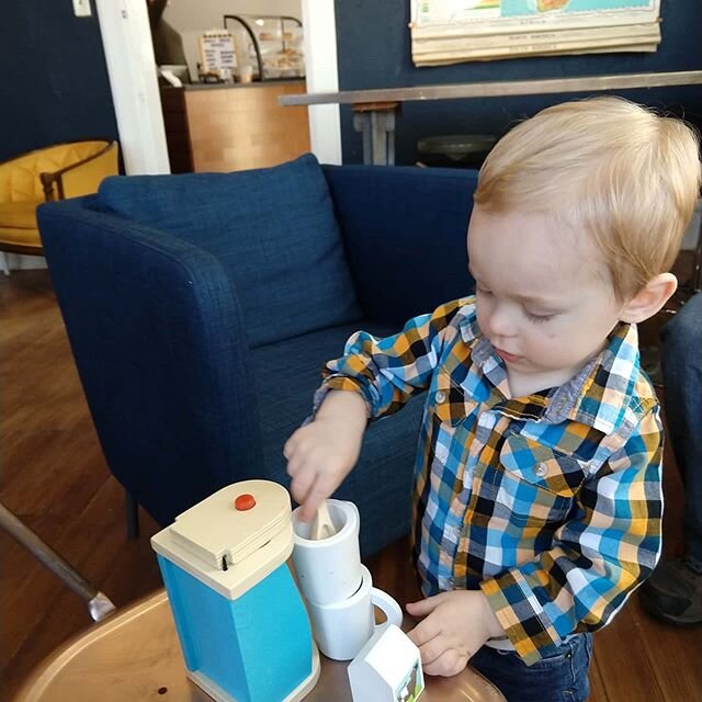 Our new Sunday morning ritual of coffee and a pastry at @coursecoffeeroasters after church reached a new level today when Warren found out about the toy coffee maker! 😍  I love watching this little guy learn new things.
.
#familytime #myboys #coffee