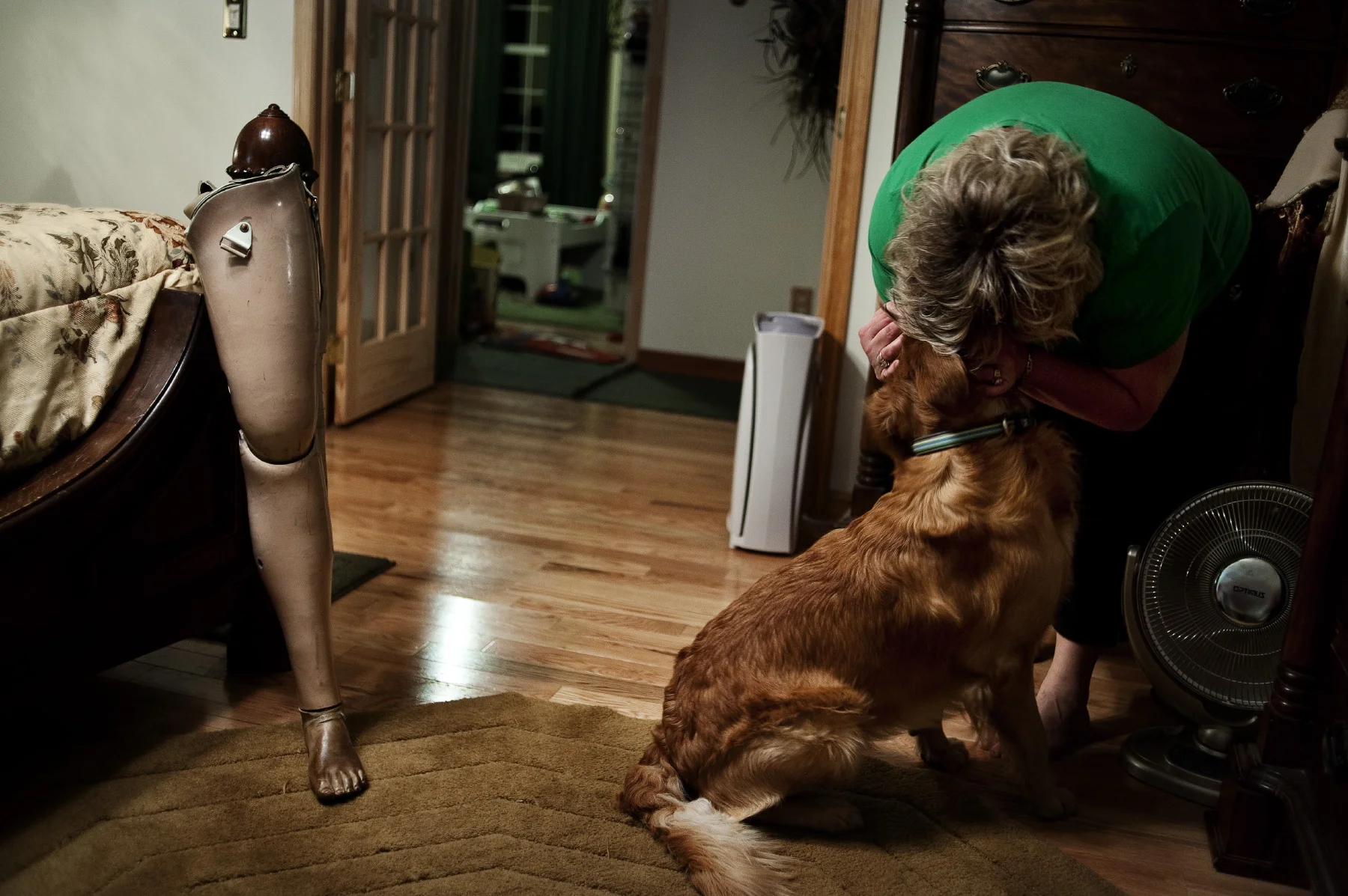  Arnett WV (USA) Coal Field resident pats her dog. His husband is a coal miner who lost his left leg on the job in a underground mine.&nbsp;&nbsp;&nbsp; 