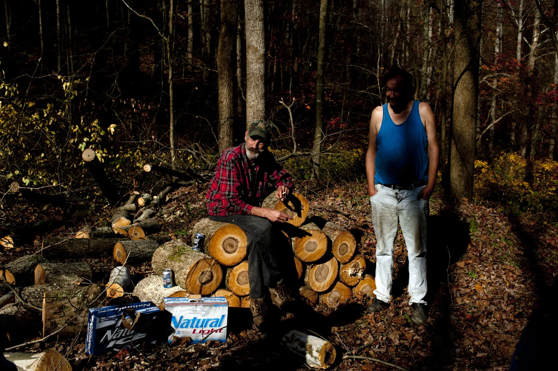  Two man take a break from a day of beer drinking and wood chopping in Naoma, WV. 