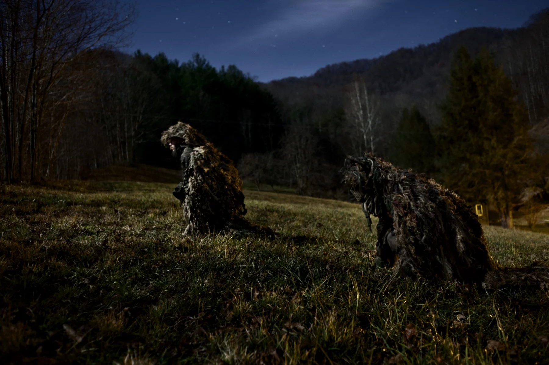  Two activists in the guilly suits they built to monitor illicit activities in strip mines. 