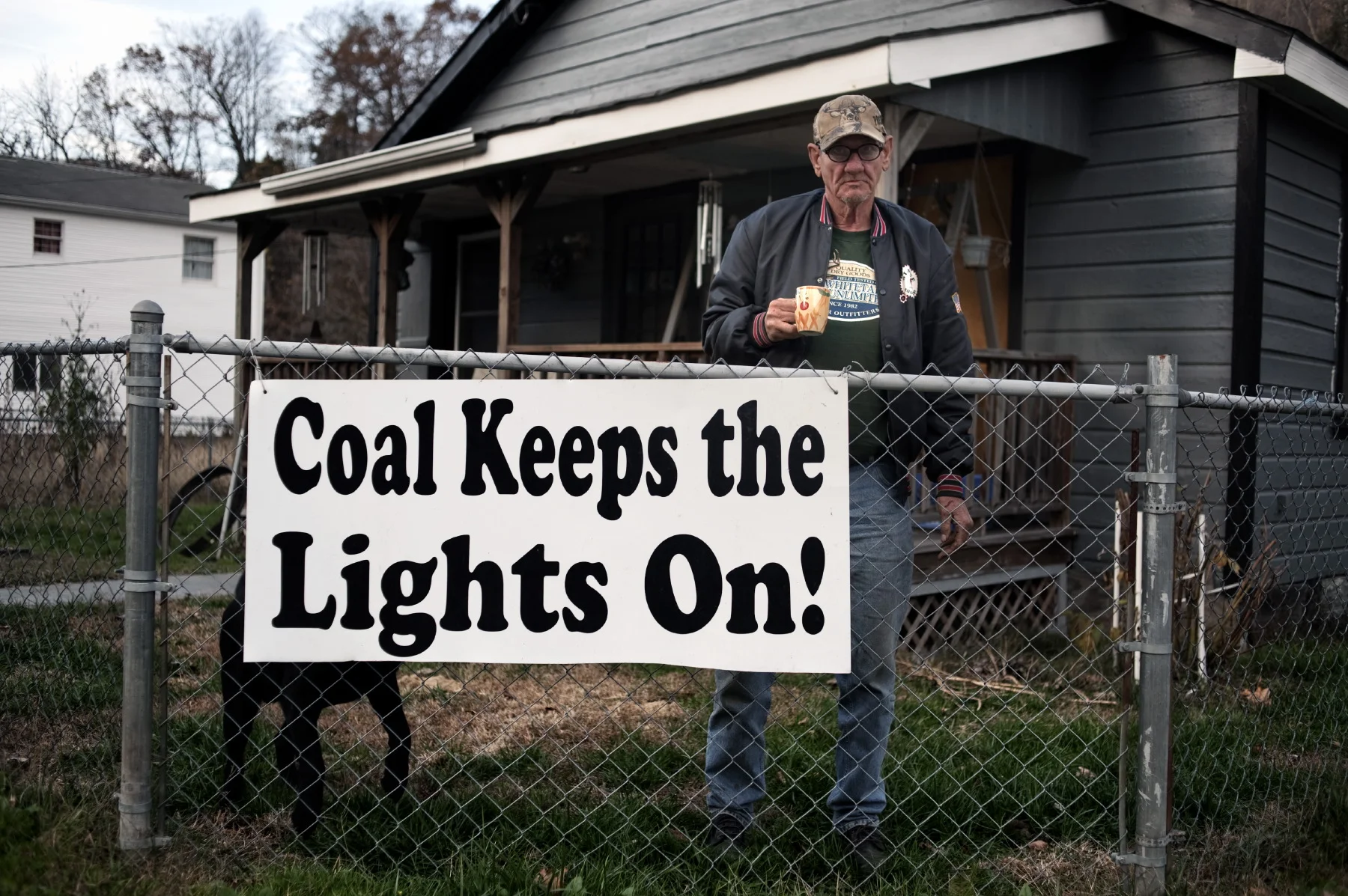  Naoma, West Virginia, September 2010 - Ernie Ruff in front of his house. Ruff is a strong supporter of coal - The writing: "Coal keeps the lights on!" - Mountaintop removal (MTR) mining is a form of surface mining that removes the summit of a mounta