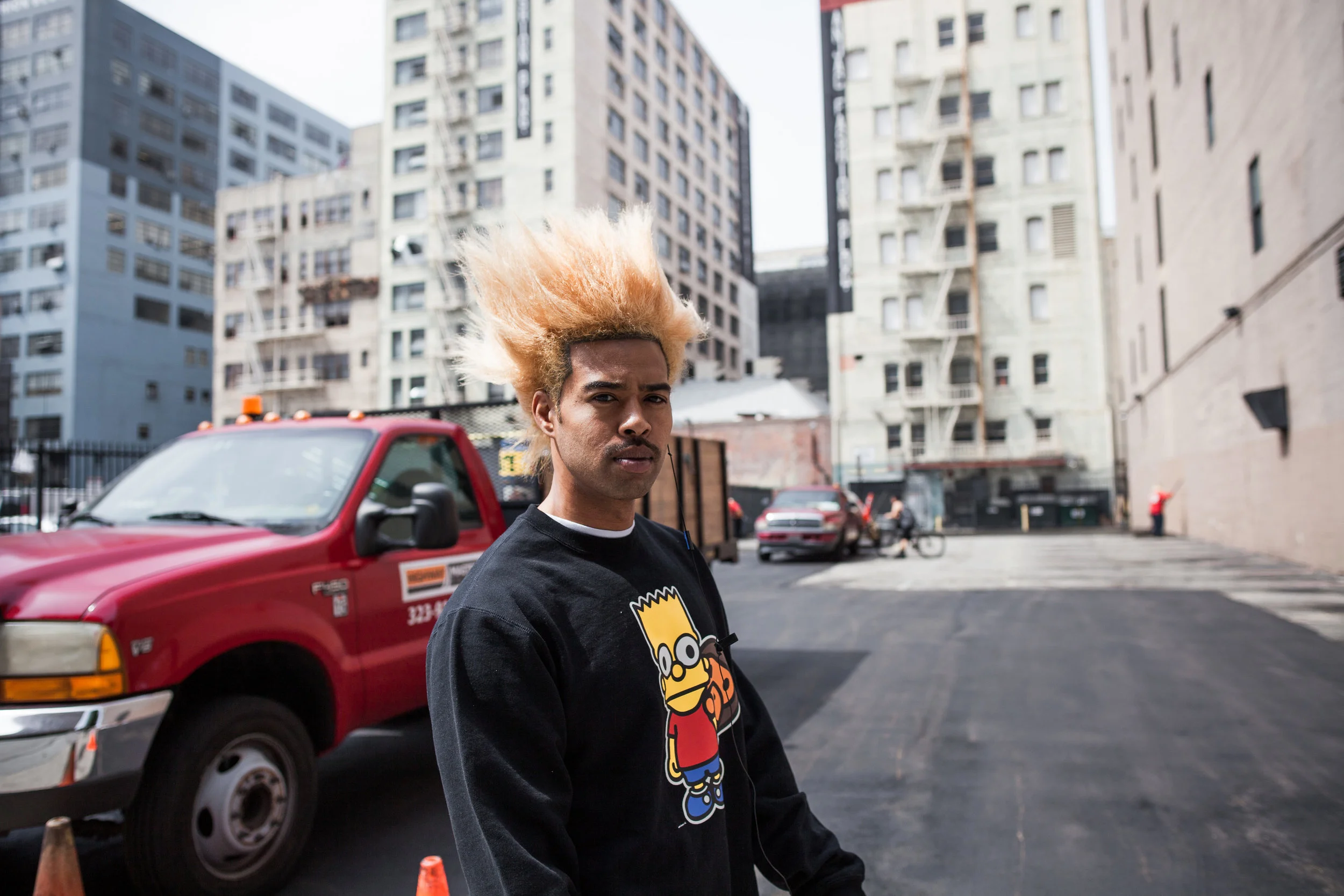 this is not nick but rather a photo he took in los angeles of a guy with bart simpson hair
