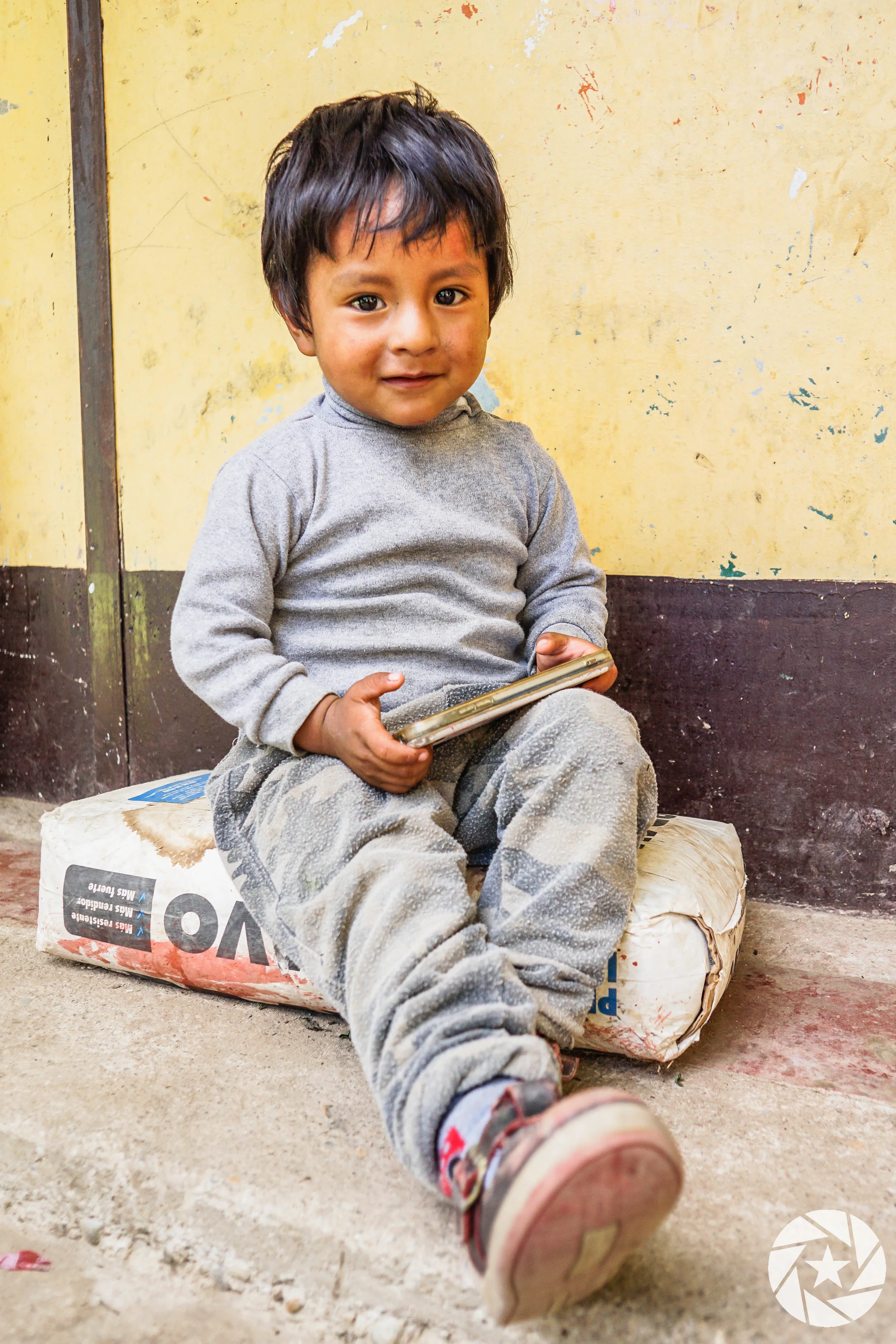 Peruvian Child with Phone