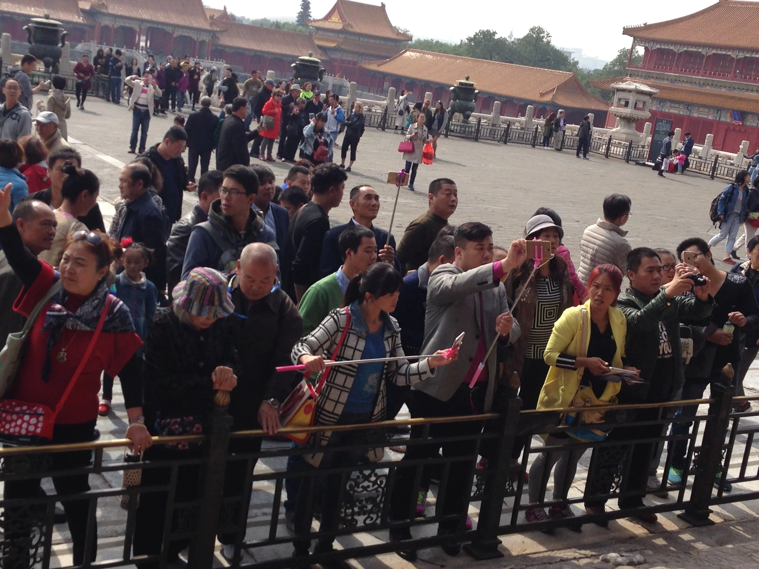 Not only are there lots of people touring the site, many of them have selfie sticks.