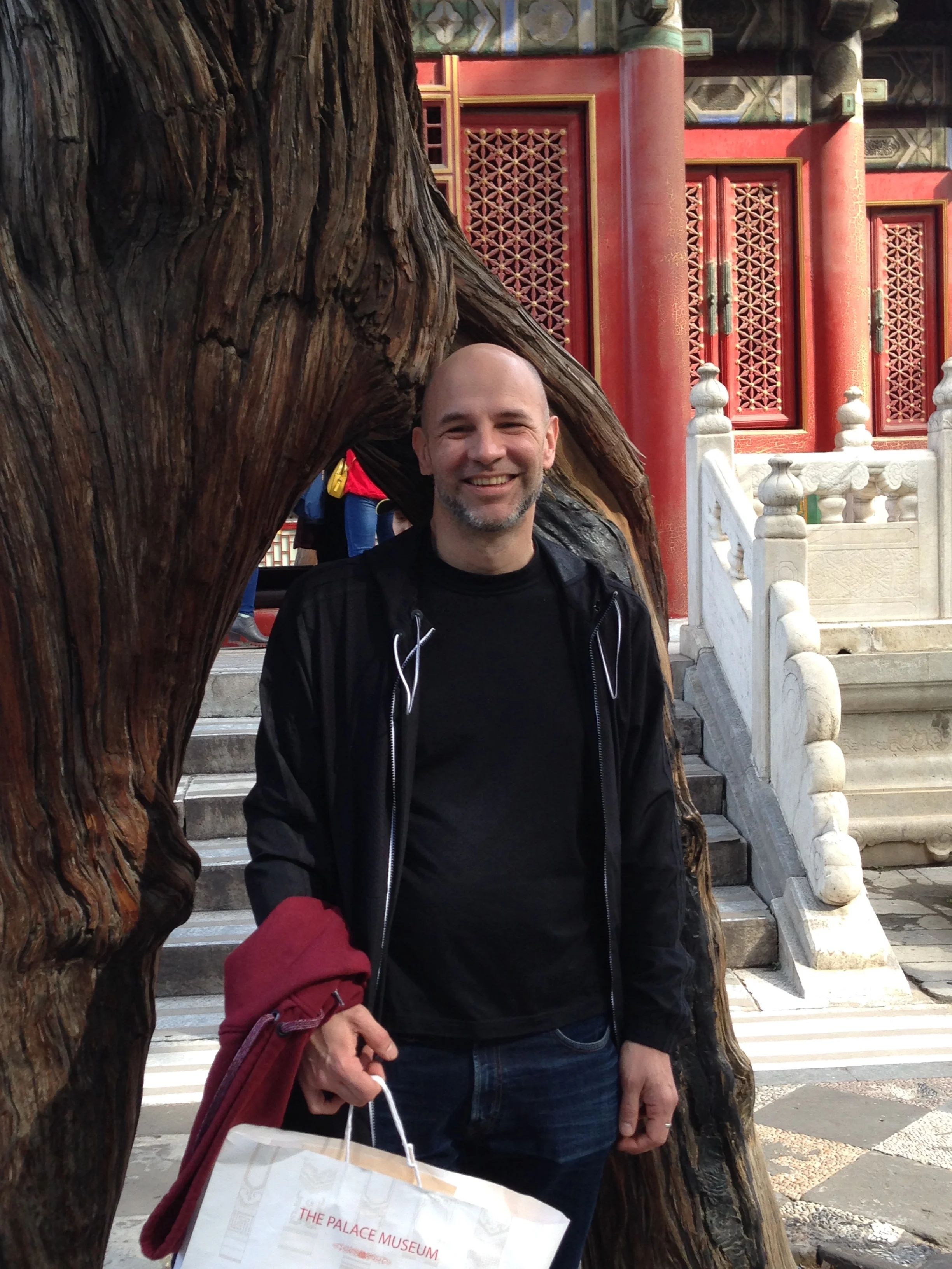 Here's Alberto, my friend and tour manager, in the garden by a tree that has an unusual arch.