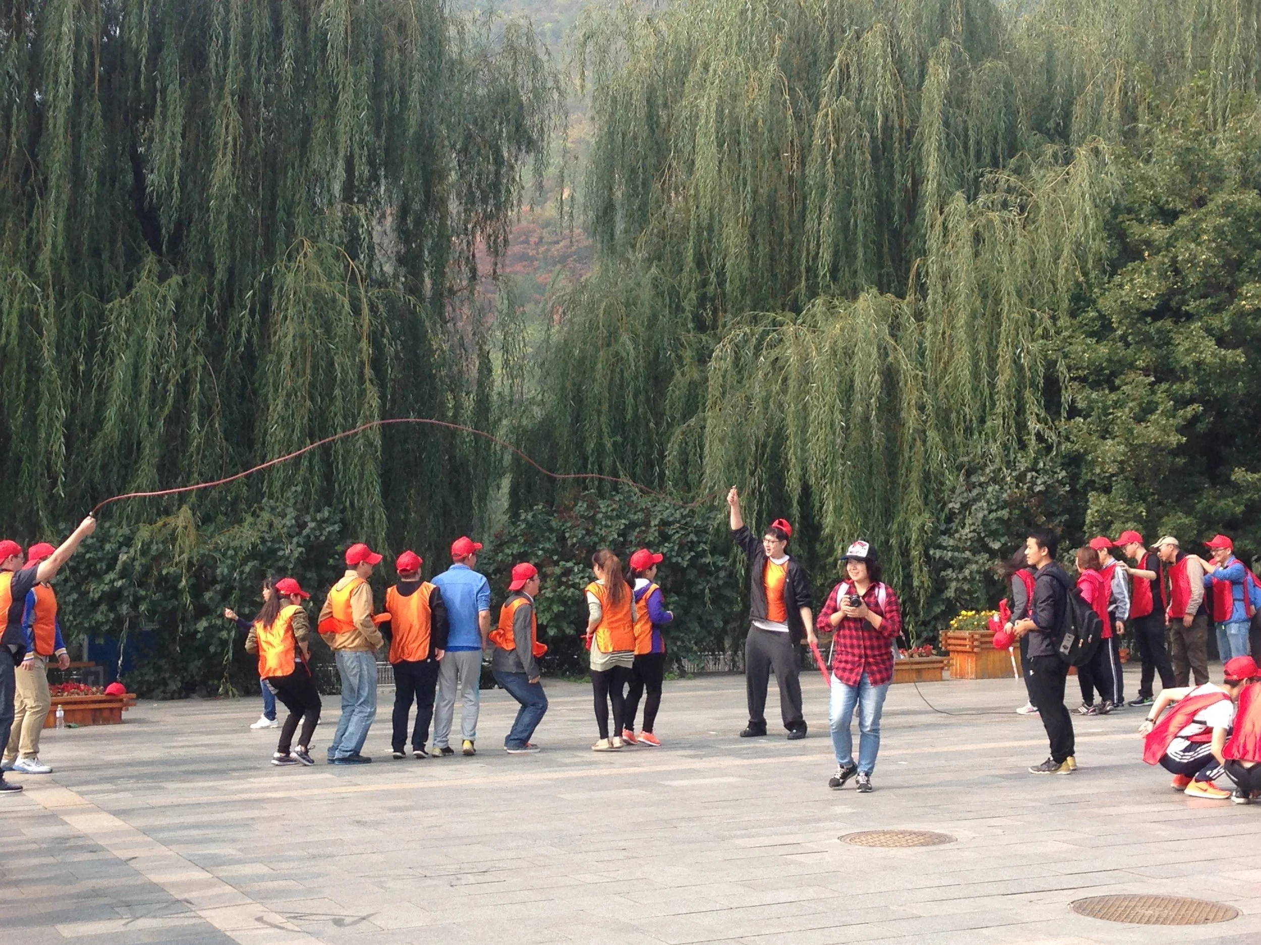 Teenagers jumping rope.