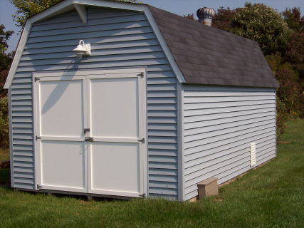   New "Azek" doors were added to this store shed as well as new vinyl siding and a new roof  