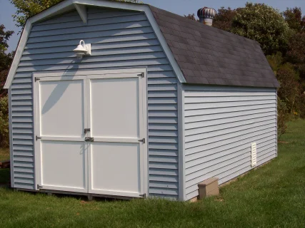 New "Azek" doors were added to this store shed as well as new vinyl siding and a new roof