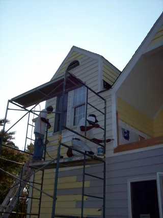 This home had a second floor flat room that had a small hole in it. The resulting damage claimed two large casement windows, all of the exterior siding, insulation and drywall. The entire side of this house was completely repaired and painted.