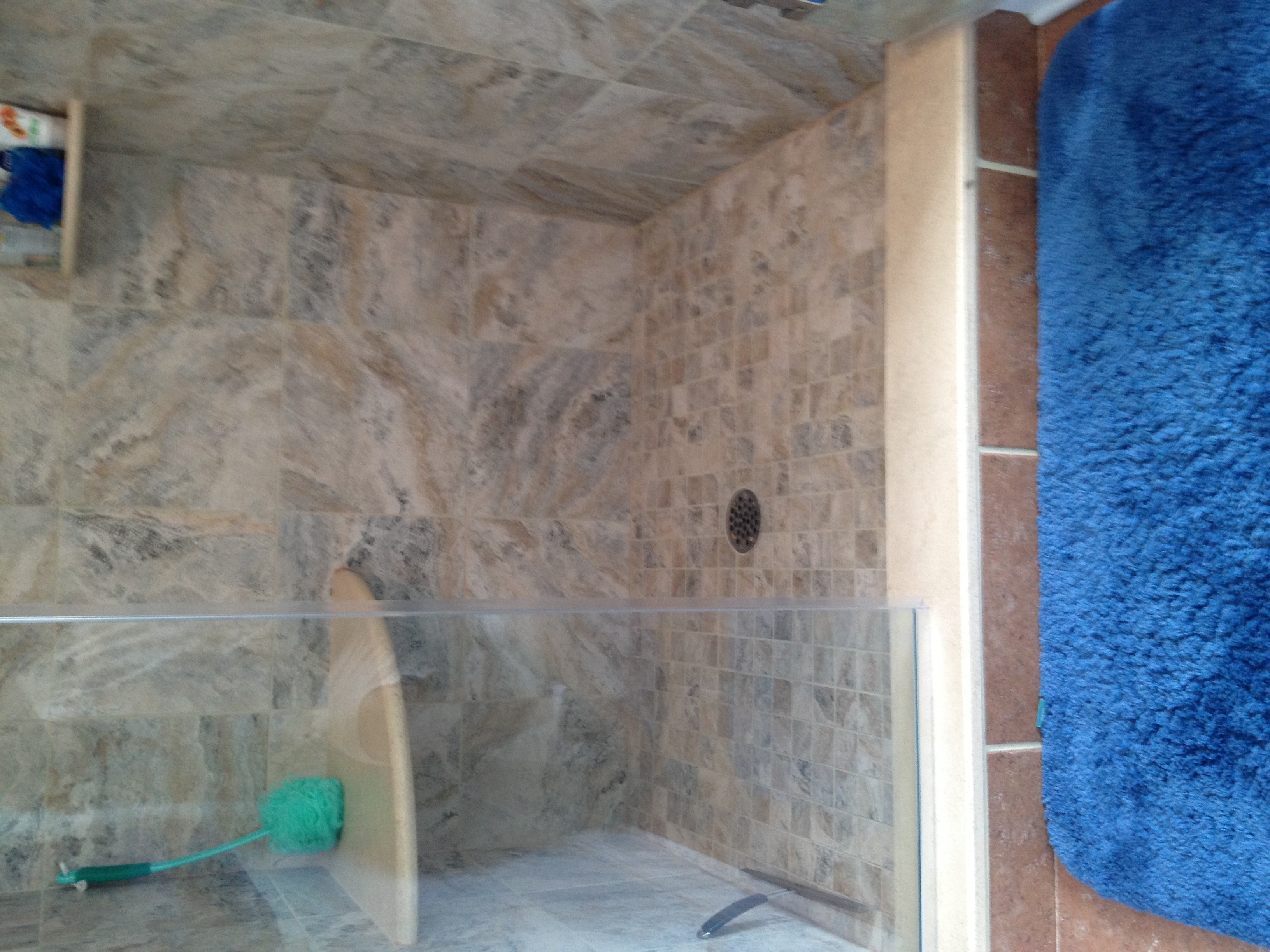  A new tiled shower with a frameless glass enclosure 